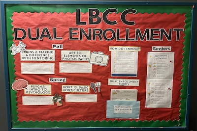 Photo of bulletin board with red background and information about LBCC Dual Enrollment